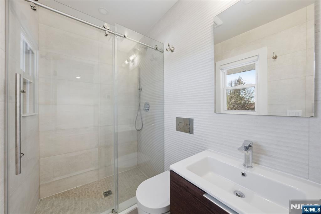 40 Magnolia Avenue Tenafly, NJ 07670 - Photo 35 of 48 a bathroom with a sink toilet and shower
