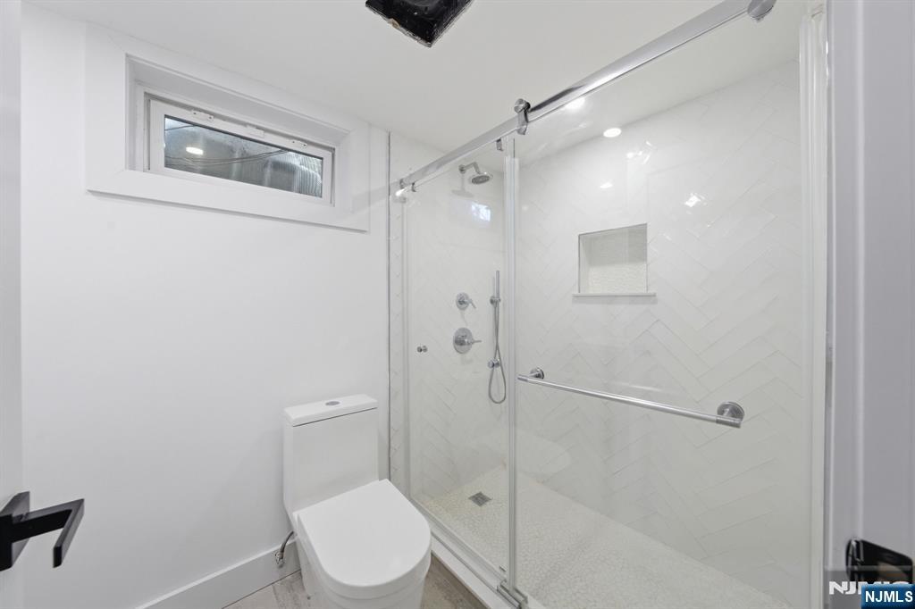40 Magnolia Avenue Tenafly, NJ 07670 - Photo 41 of 48 a bathroom with a toilet and a shower