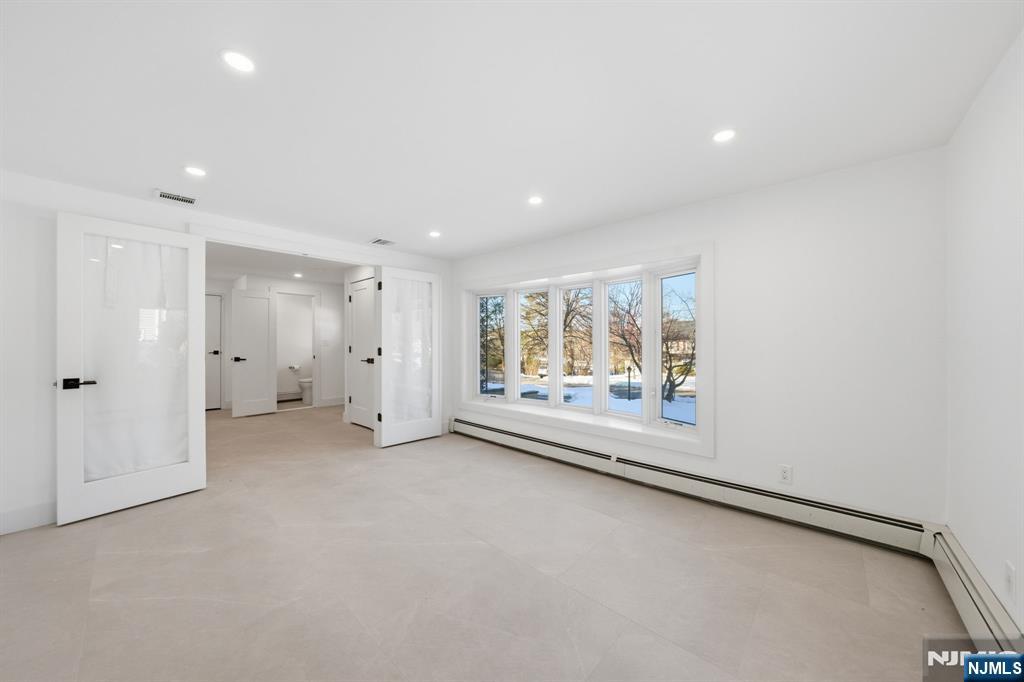 40 Magnolia Avenue Tenafly, NJ 07670 - Photo 7 of 48 a view of an empty room with a window