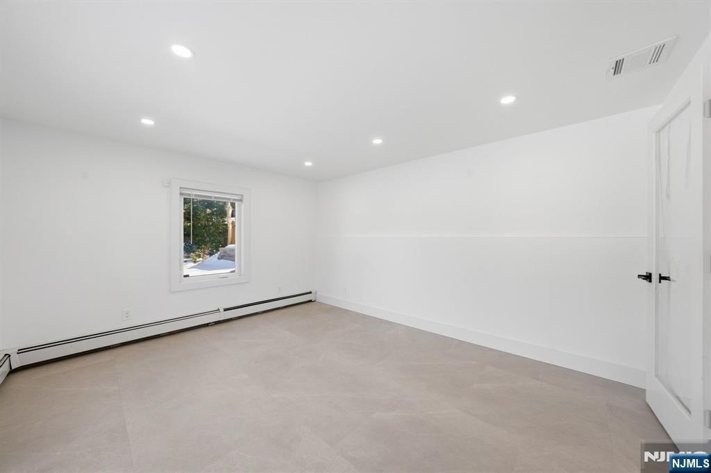 40 Magnolia Avenue Tenafly, NJ 07670 - Photo 9 of 48 a view of an empty room with a window