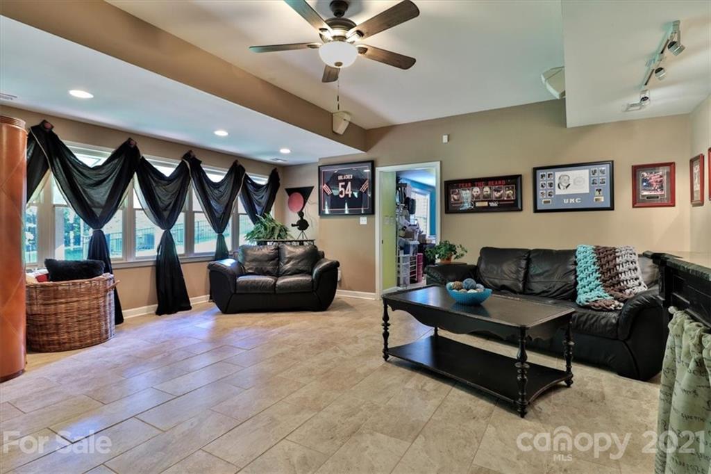796 Portpatrick Place Fort Mill, SC 29708 - Photo 36 of 48 a living room with furniture and a ceiling fan