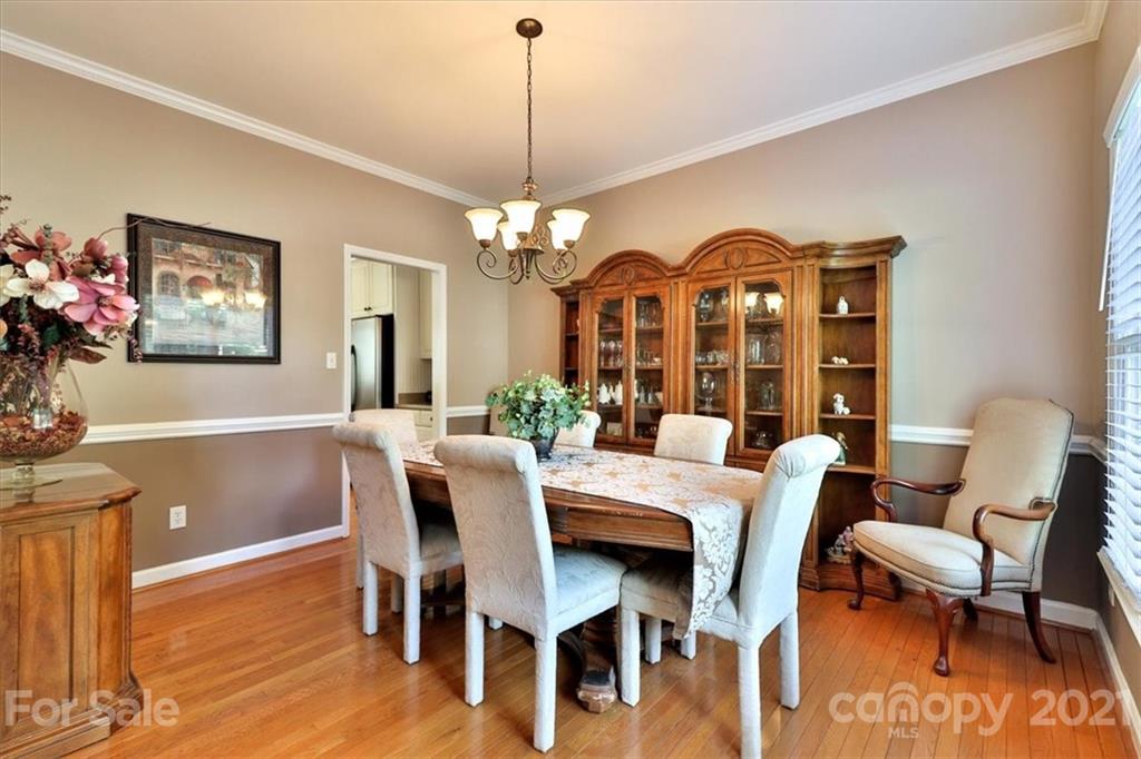 796 Portpatrick Place Fort Mill, SC 29708 - Photo 4 of 48 a view of a dining room with furniture and chandelier