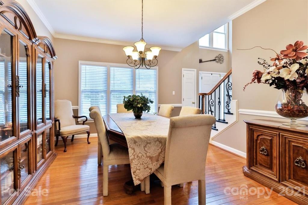 796 Portpatrick Place Fort Mill, SC 29708 - Photo 5 of 48 a view of a dining room with furniture window and wooden floor