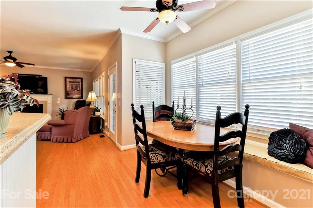 796 Portpatrick Place Fort Mill, SC 29708 - Photo 10 of 48 a view of a dining room with furniture and chandelier