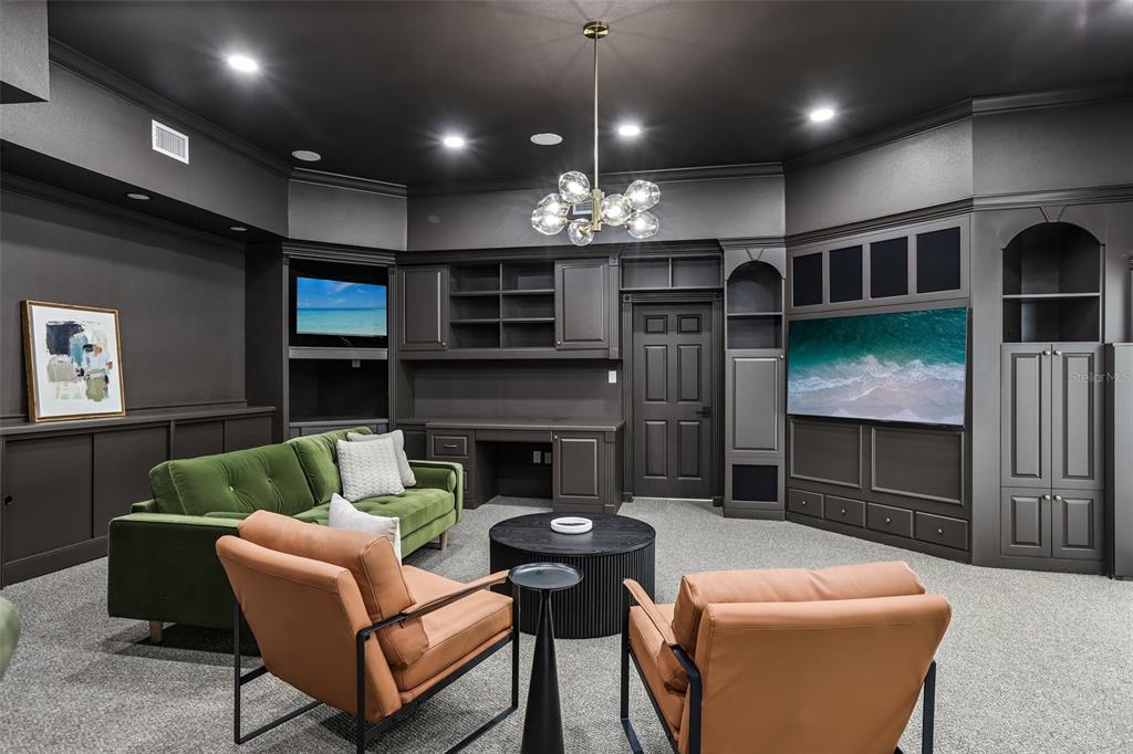 1012 Morfield Lane Brandon, FL 33511 - Photo 45 of 100 a living room with furniture a fireplace and a flat screen tv