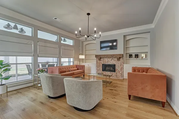 a open kitchen with white cabinets and stainless steel appliances