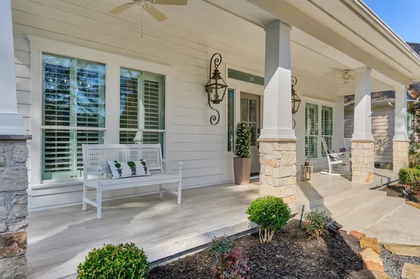 a front view of a house with outdoor seating