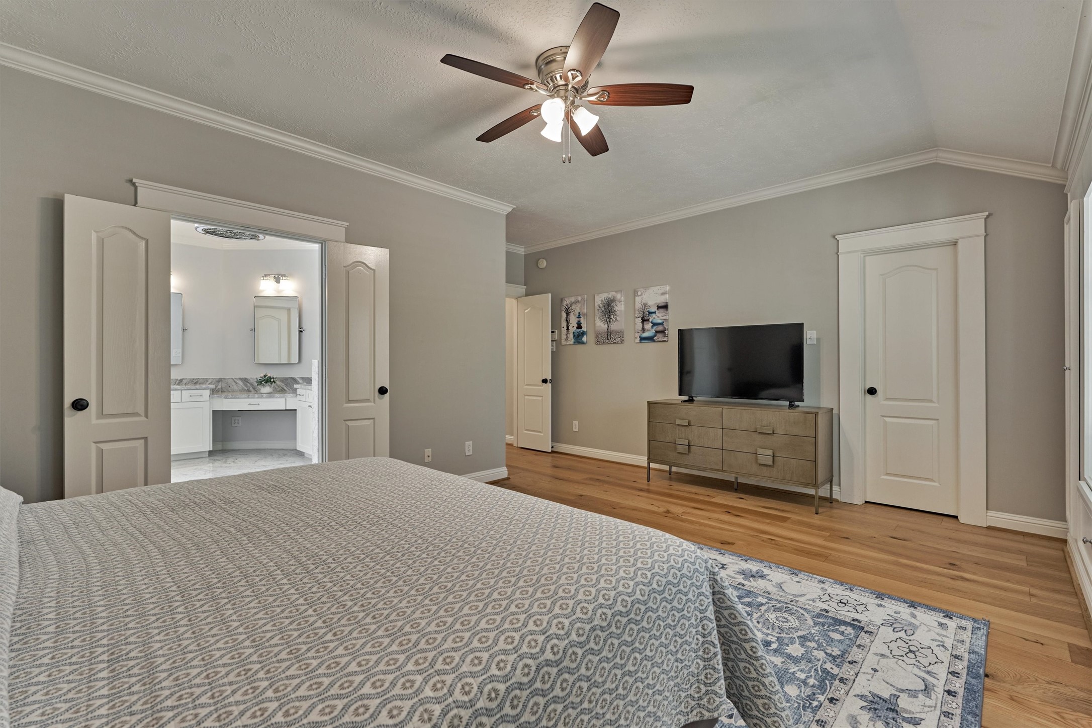 19 Pipers Meadow Street Spring, TX 77382 - Photo 19 of 50 a bedroom with a bed and a flat screen tv