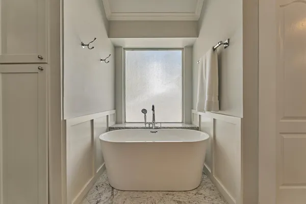 a bathroom with double sink and a mirror