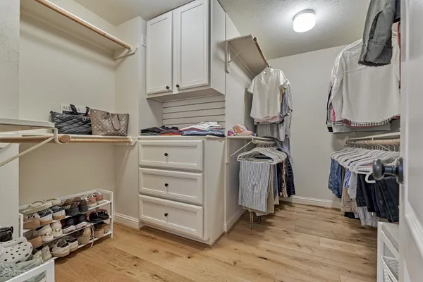 a bathroom with a shower sink and mirror