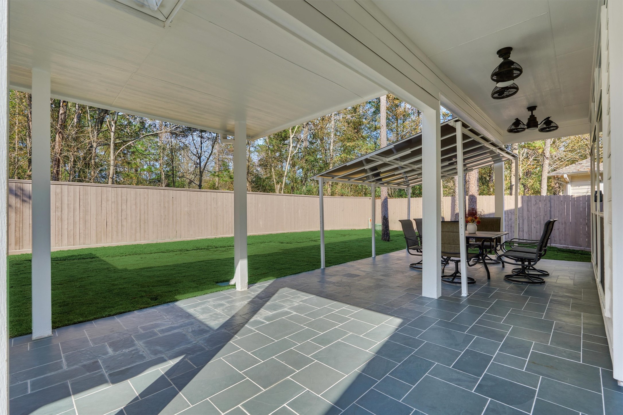 19 Pipers Meadow Street Spring, TX 77382 - Photo 33 of 50 a view of a porch with chairs and backyard