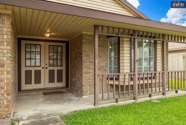 a view of a house with a backyard