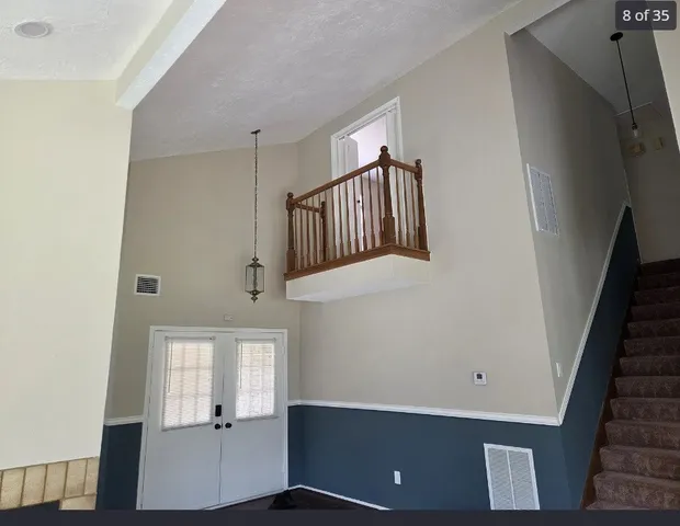 a view of an entryway with wooden floor