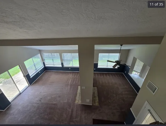 a view of an empty room and window