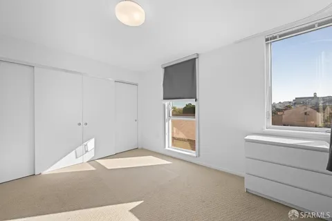 a room with a fireplace and a window