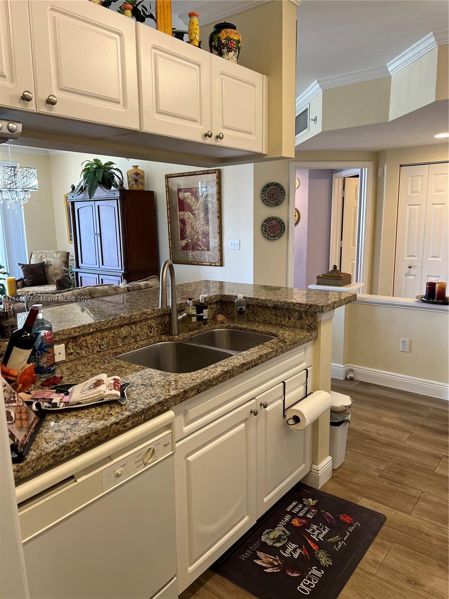 17100 North Bay Road, Unit 1701 Sunny Isles Beach, FL 33160 - Photo 24 of 84 a kitchen with stainless steel appliances granite countertop a sink stove and cabinets