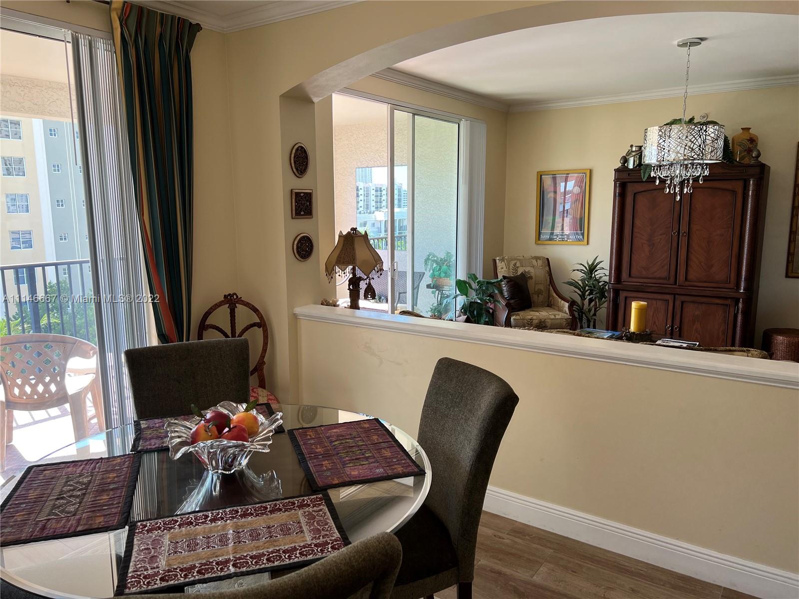 17100 North Bay Road, Unit 1701 Sunny Isles Beach, FL 33160 - Photo 26 of 84 a living room with furniture and a window