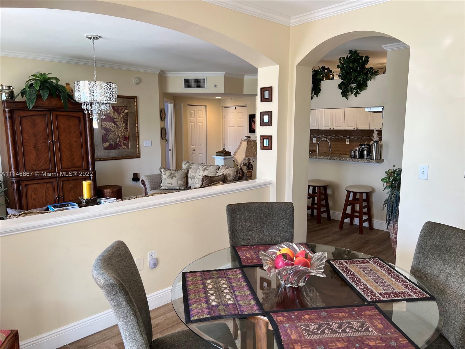 17100 North Bay Road, Unit 1701 Sunny Isles Beach, FL 33160 - Photo 27 of 84 a living room with furniture and wooden floor