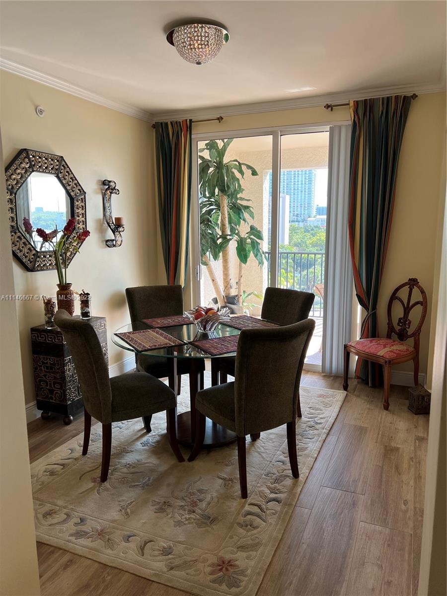17100 North Bay Road, Unit 1701 Sunny Isles Beach, FL 33160 - Photo 29 of 84 a view of a dining room with furniture window and wooden floor