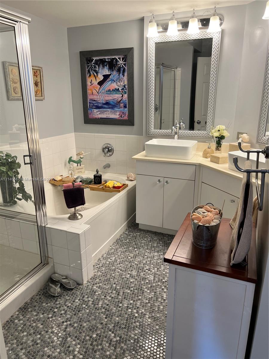 17100 North Bay Road, Unit 1701 Sunny Isles Beach, FL 33160 - Photo 33 of 84 a white sink sitting next to a white toilet and vanity