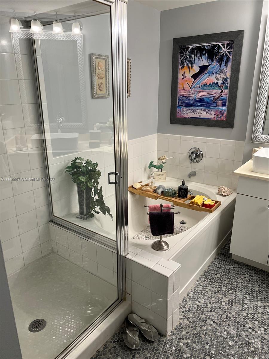 17100 North Bay Road, Unit 1701 Sunny Isles Beach, FL 33160 - Photo 38 of 84 a bathroom with a tub and a shower