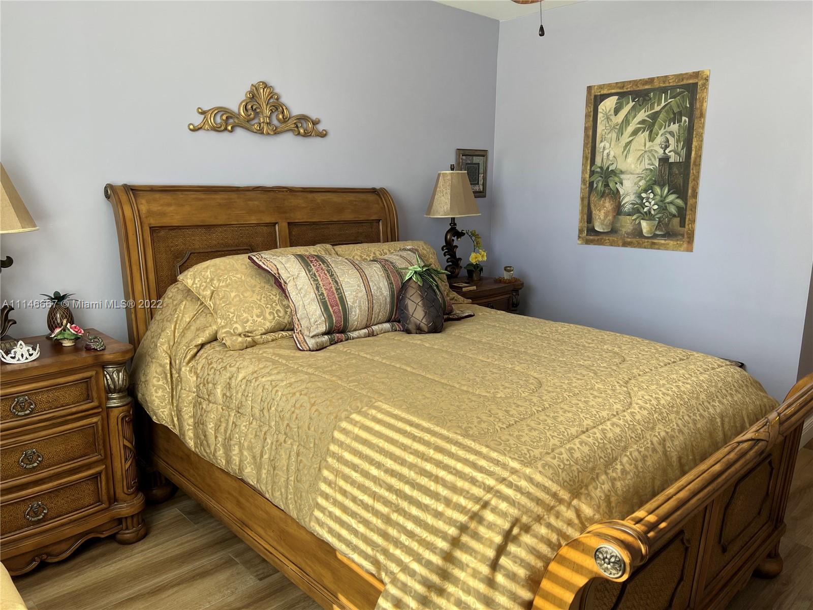 17100 North Bay Road, Unit 1701 Sunny Isles Beach, FL 33160 - Photo 42 of 84 a bed sitting in a bedroom next to a lamp
