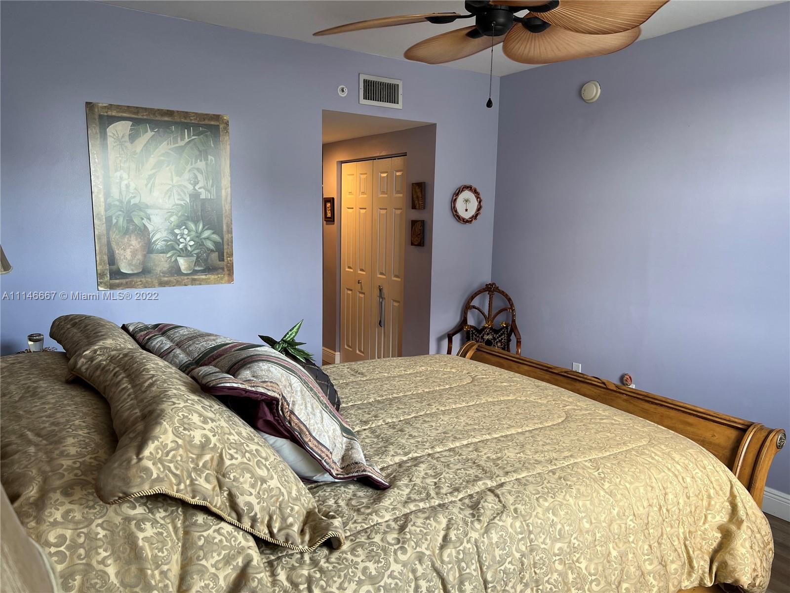 17100 North Bay Road, Unit 1701 Sunny Isles Beach, FL 33160 - Photo 45 of 84 a bedroom with a bed and a chandelier
