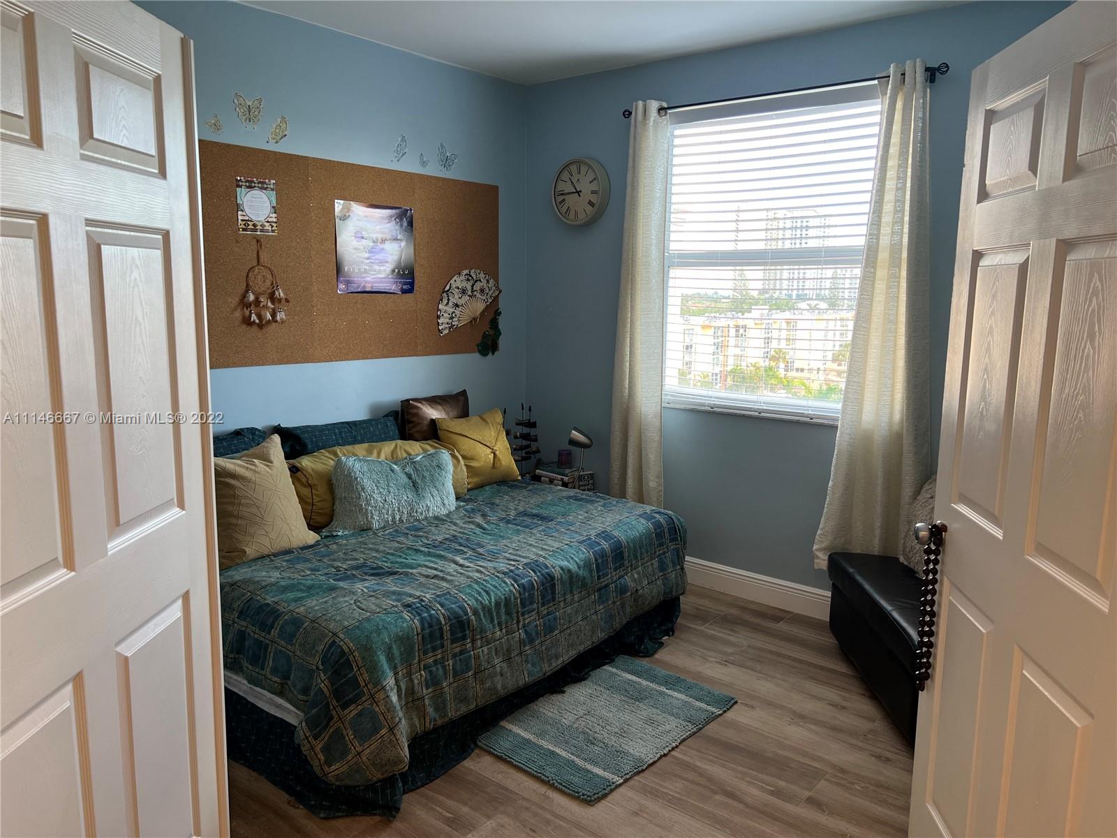 17100 North Bay Road, Unit 1701 Sunny Isles Beach, FL 33160 - Photo 49 of 84 a bedroom with a bed and a window