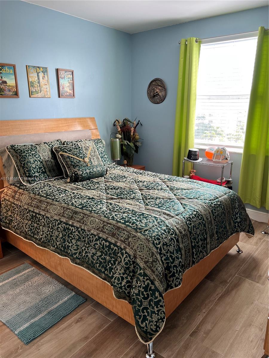 17100 North Bay Road, Unit 1701 Sunny Isles Beach, FL 33160 - Photo 53 of 84 a bedroom with a bed and a window