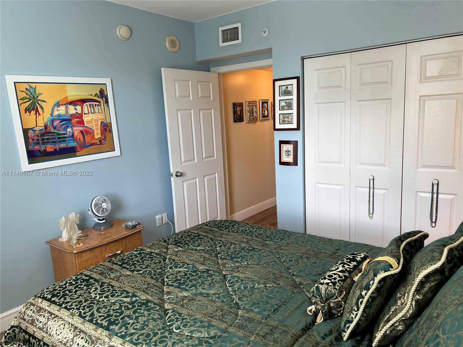 17100 North Bay Road, Unit 1701 Sunny Isles Beach, FL 33160 - Photo 55 of 84 a bedroom with a bed and wooden floor