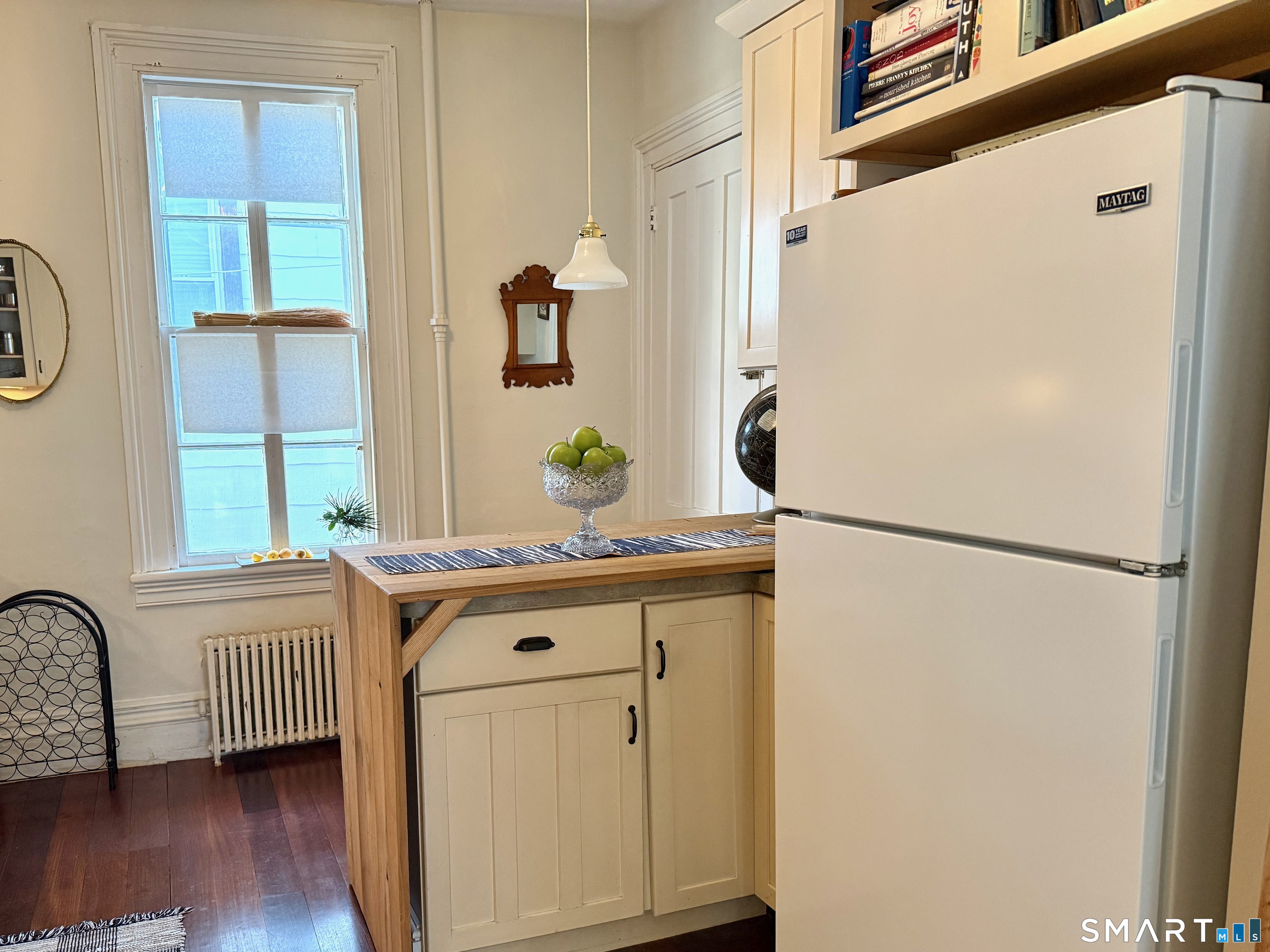 137 Water Street, Unit 2 Stonington, CT 06378 - Photo 11 of 18 a kitchen with appliances a refrigerator and a window