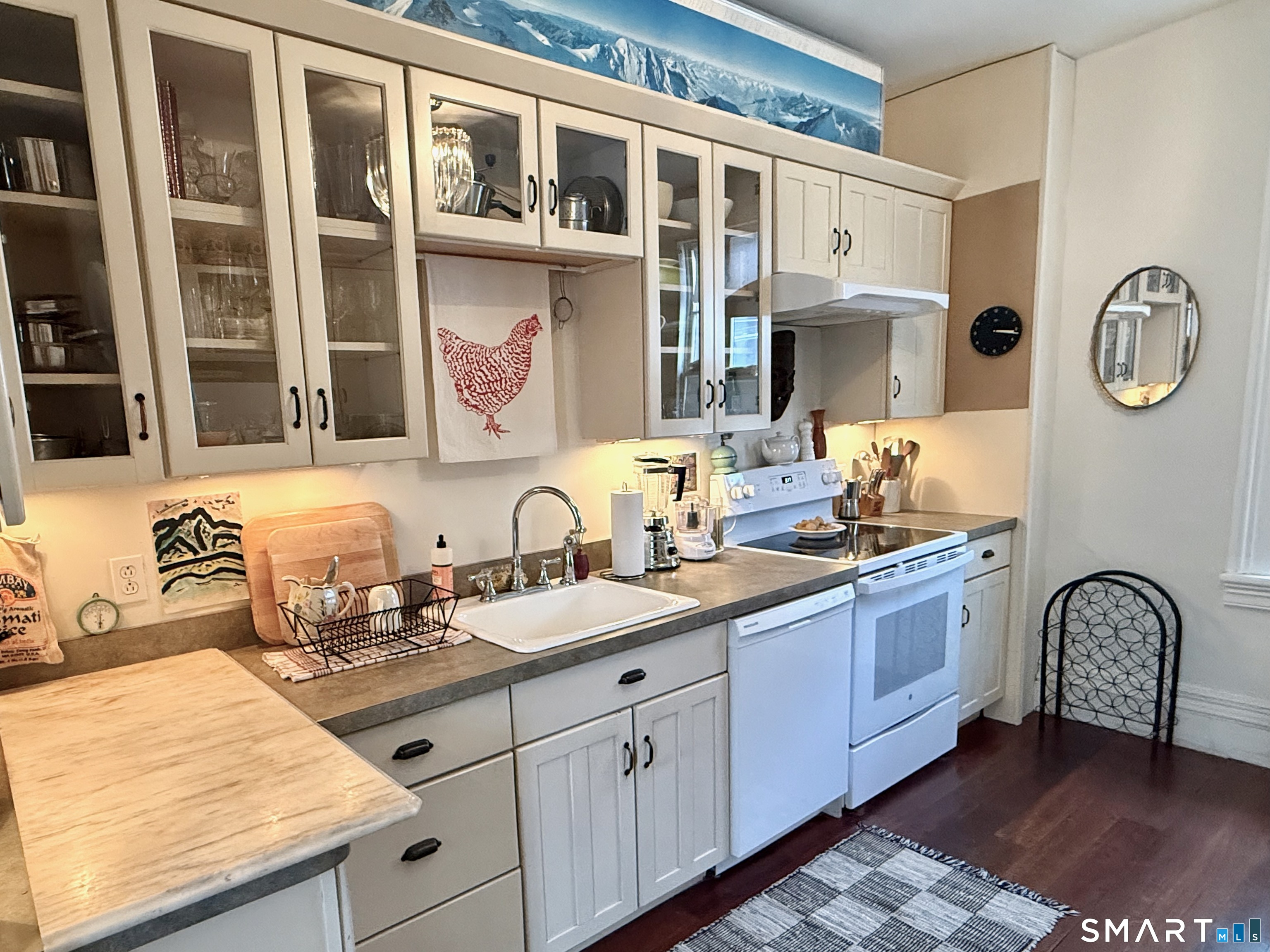 137 Water Street, Unit 2 Stonington, CT 06378 - Photo 15 of 18 a spacious bathroom with a granite countertop sink and a mirror