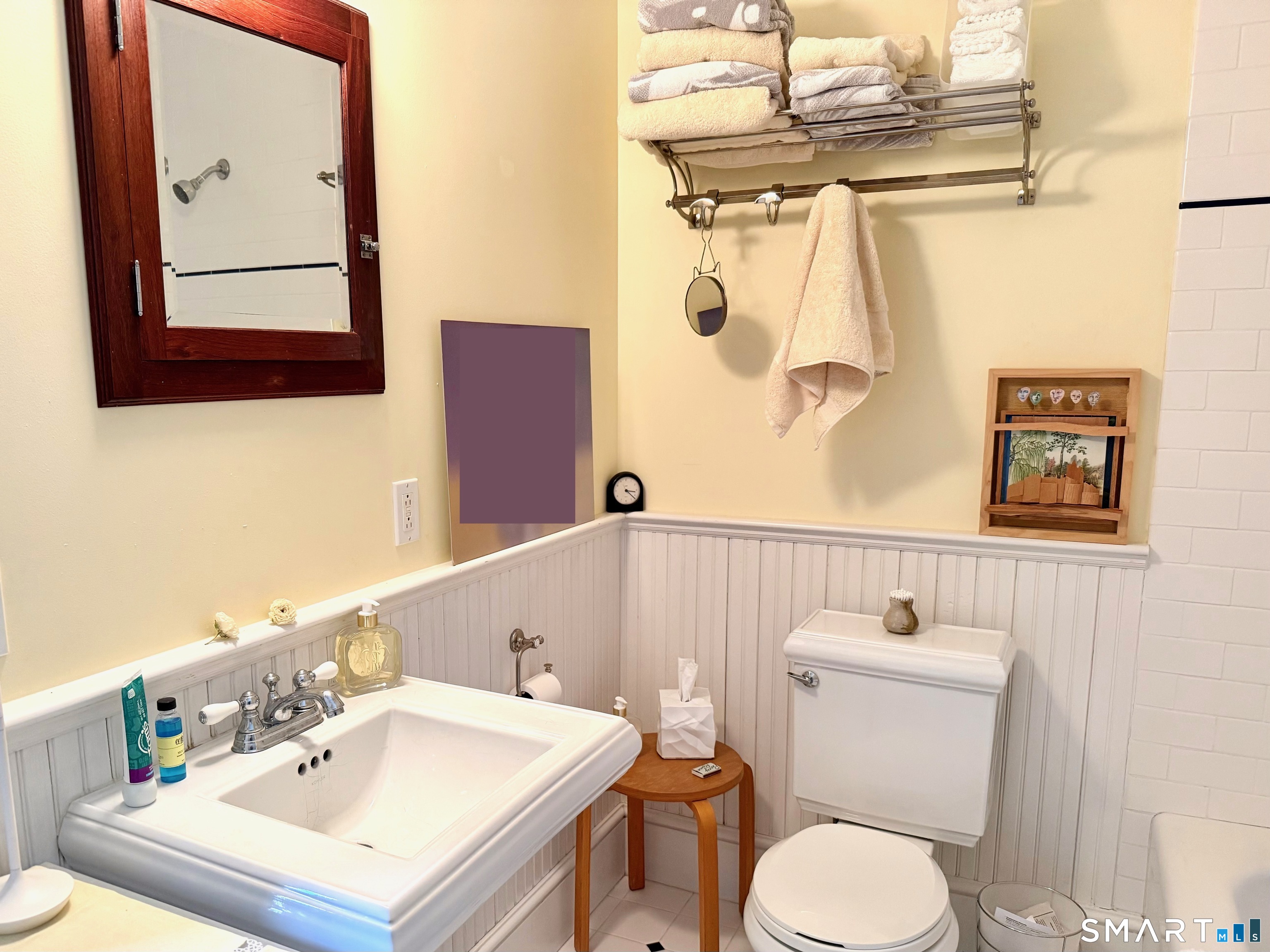 137 Water Street, Unit 2 Stonington, CT 06378 - Photo 18 of 18 a white toilet sitting next to a bathroom sink