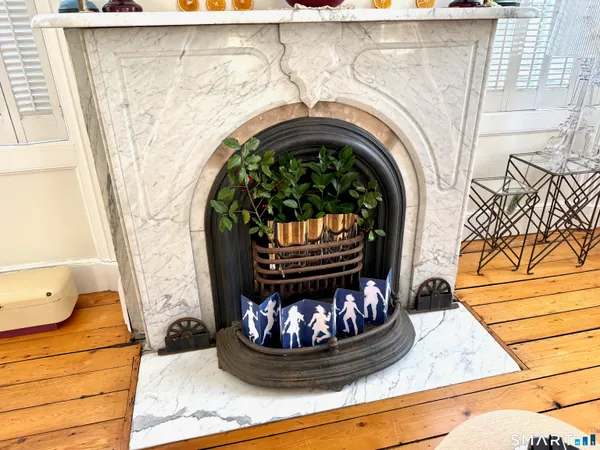 a view of a fireplace with washer and dryer