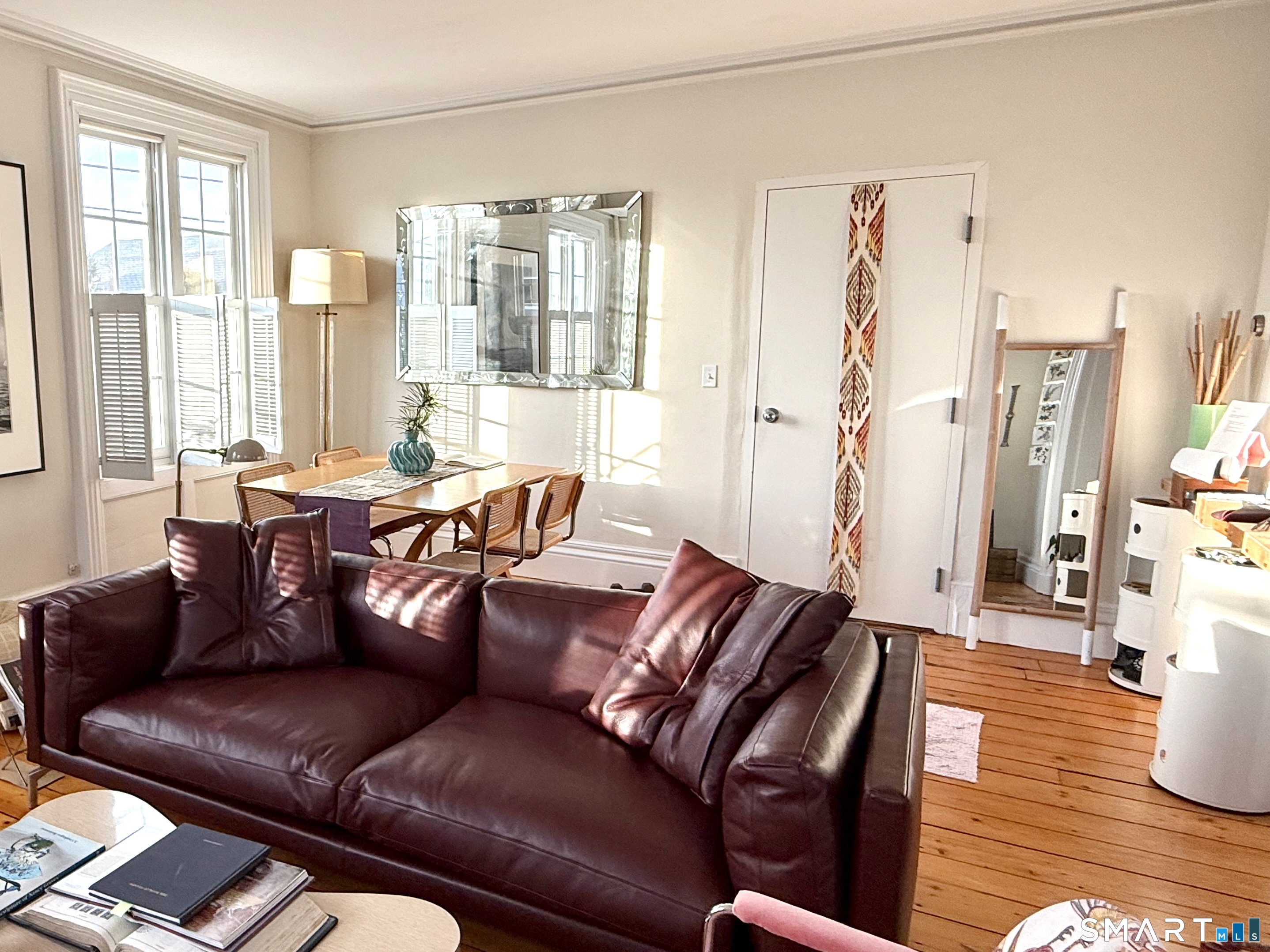 137 Water Street, Unit 2 Stonington, CT 06378 - Photo 5 of 18 a living room with furniture and a large window