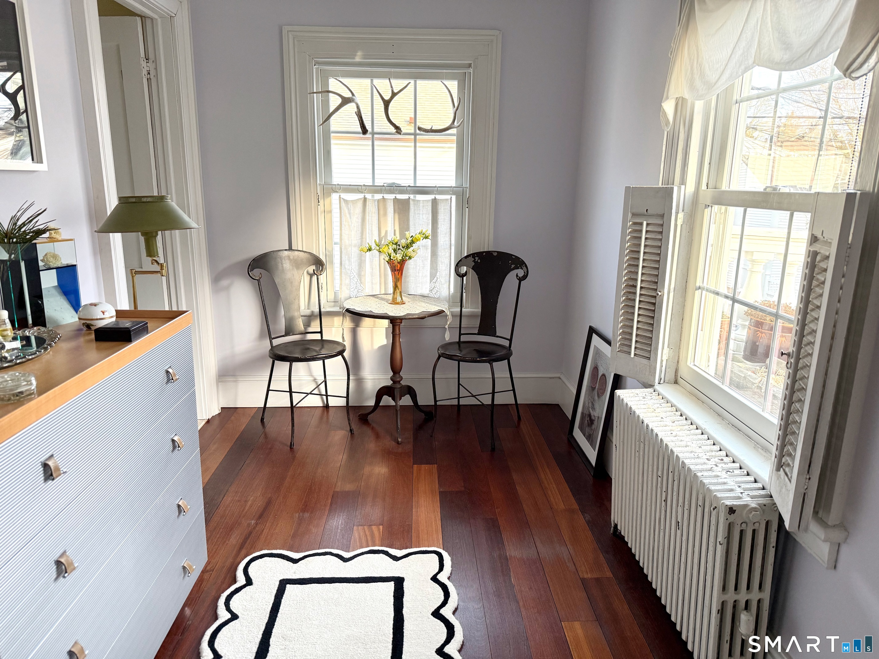 137 Water Street, Unit 2 Stonington, CT 06378 - Photo 7 of 18 a living room with furniture and a window