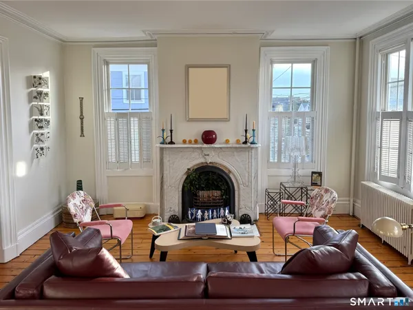 a living room with furniture and a fireplace