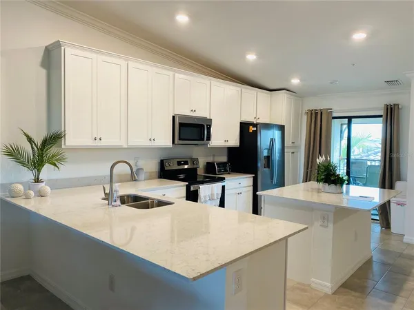 a work room with furniture and a flat screen tv