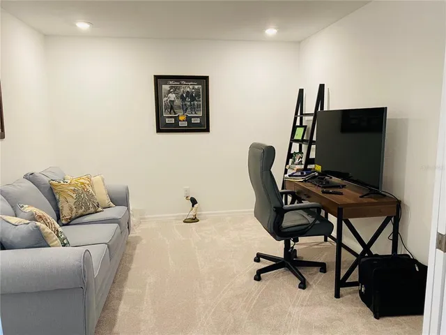 a living room with furniture and window