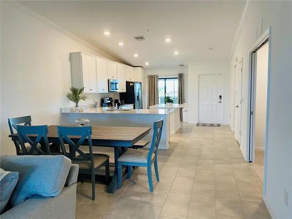 a living room with furniture and a lamp