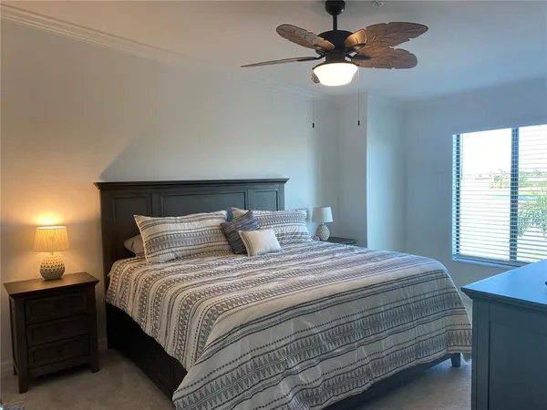 a bedroom with a bed and window