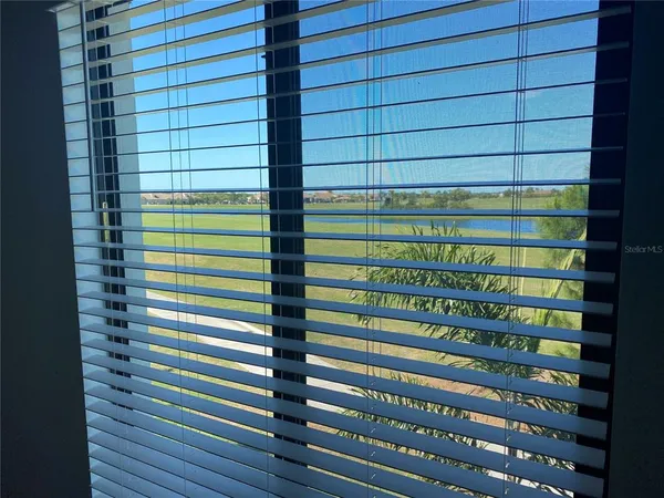 a bathroom with a double vanity sink mirror and shower