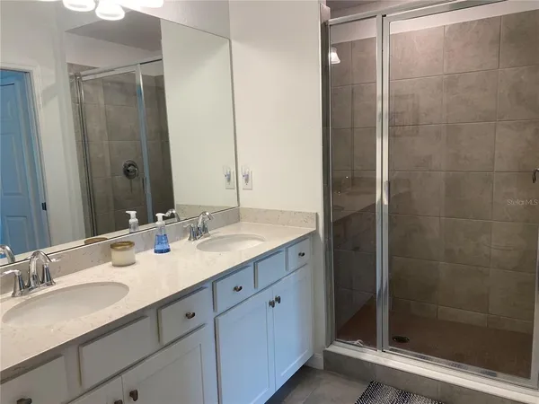 a balcony with furniture and a potted plant
