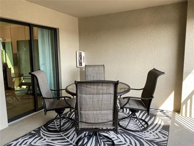 a kitchen with a stove and a white cabinets