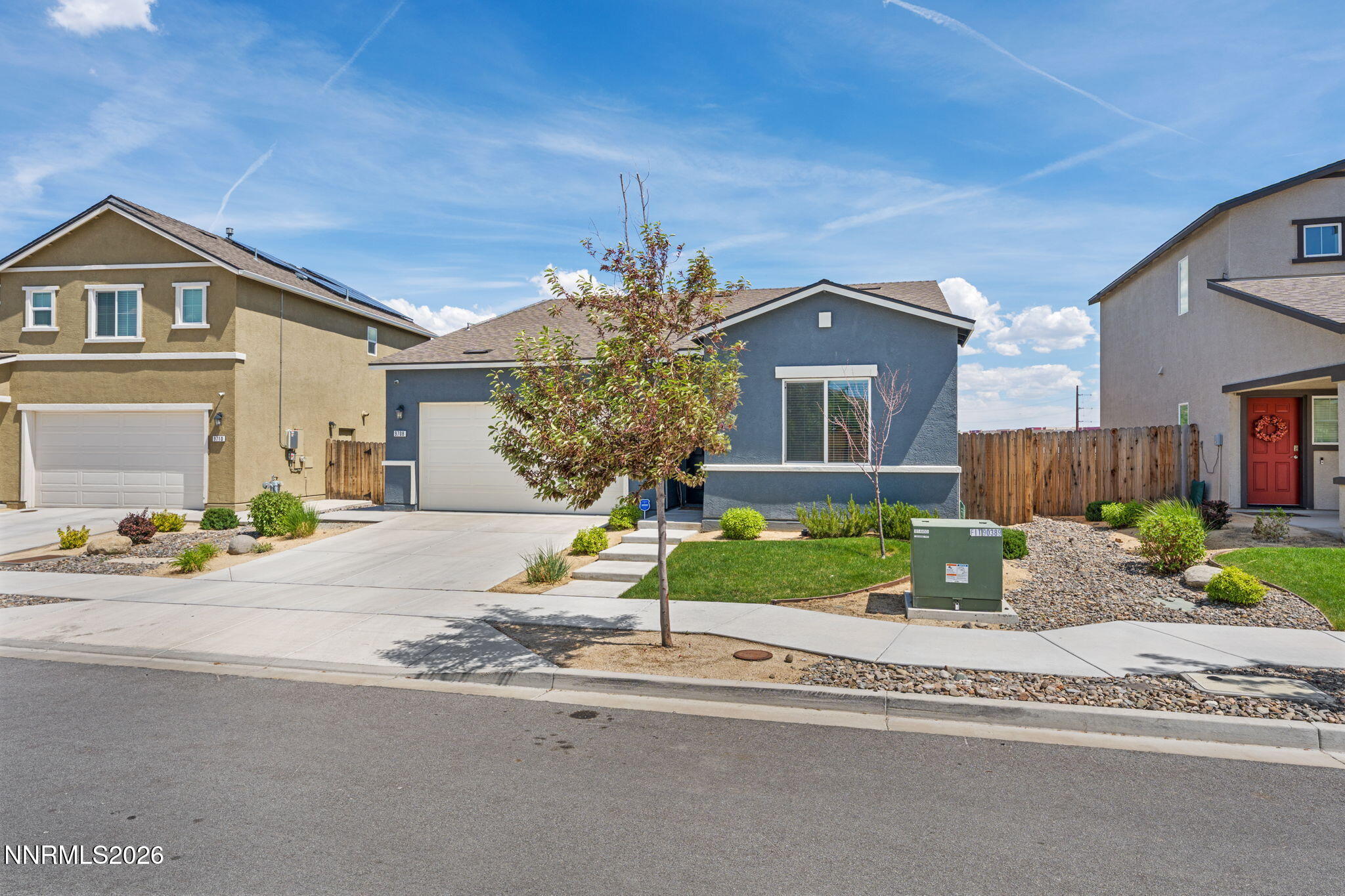 9708 Sea Glass Drive Reno, NV 89506 - Photo 3 of 51 a front view of a house with a yard and potted plants