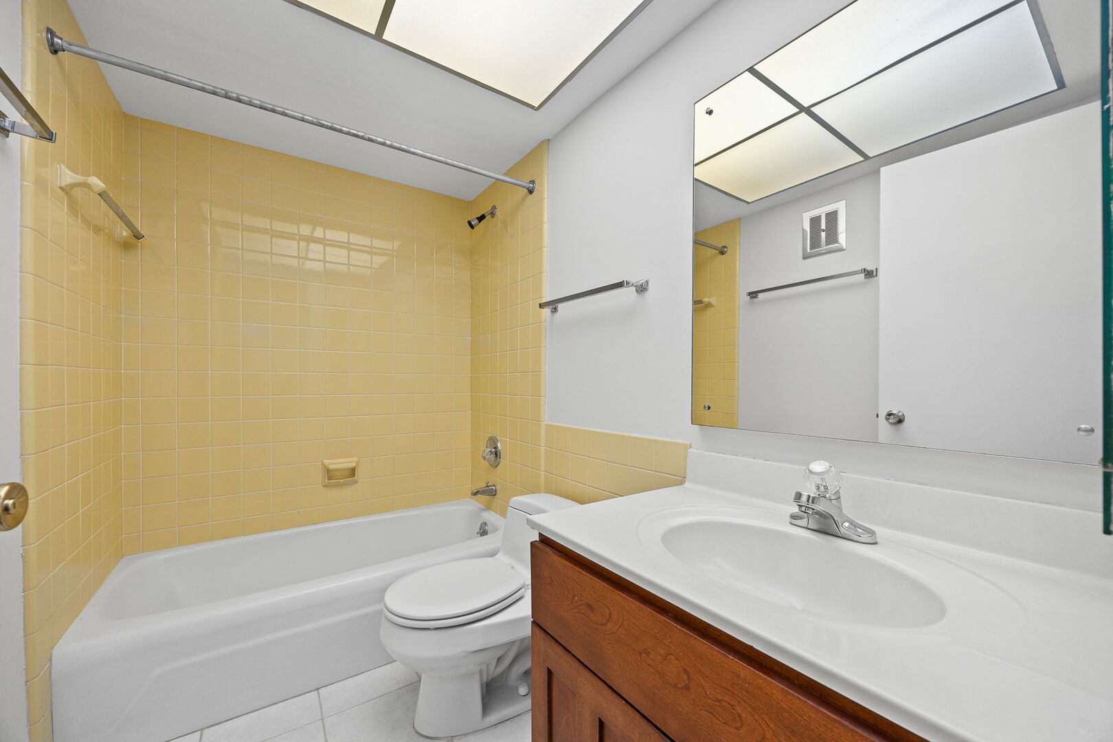 124 Carriage Way Drive, Unit B109 Burr Ridge, IL 60527 - Photo 22 of 31 a bathroom with a sink a toilet and shower