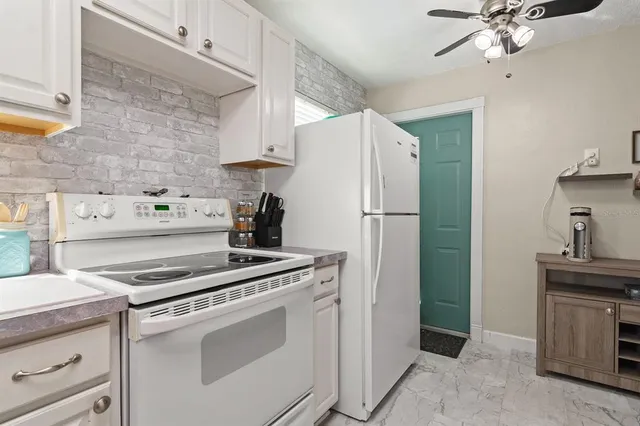 a kitchen with a stove microwave and refrigerator