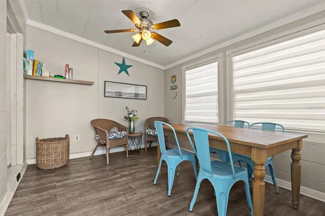 a view of a dining room with furniture window and wooden floor