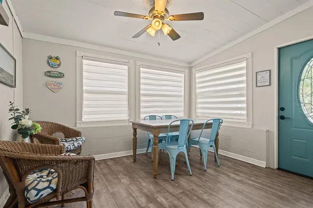 a view of a dining room with furniture and wooden floor
