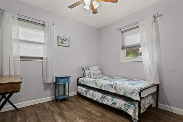 a bedroom with a bed and a table